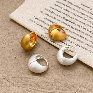Elegant gold and silver matte water drop hoop earrings with a brushed metallic finish