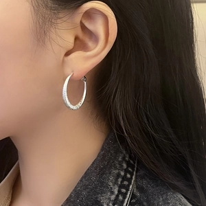Minimalist silver hoop earrings with hammered texture finish for stylish women