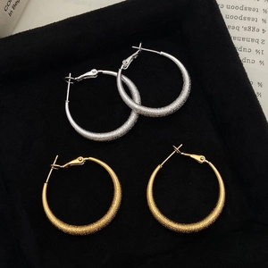 Classic gold and silver stardust hoop earrings with sparkling sandblasted finish in a gift box