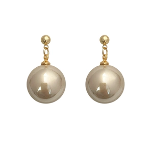 French vintage champagne pearl earrings with gold chain in minimalist elegant style