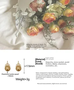 Detail of crown pearl earrings in gold finish with measurements and quality materials