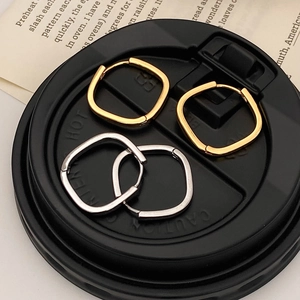 Minimalist square geometric huggie earrings in polished gold and silver finishes