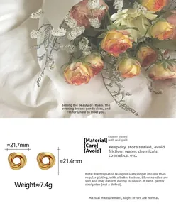 Detail of twisted gold-plated stud earrings with size specs and copper material