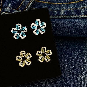 Exquisite olive green and blue marquise zircon floral stud earrings on black velvet