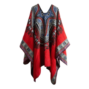 Macro detail of ethnic geometric jacquard and paisley patterns on red cashmere shawl