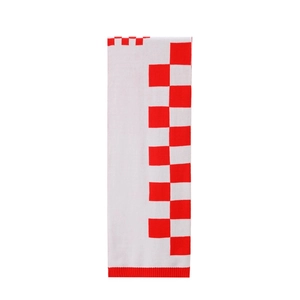 Detail view of the red and white checkered knit scarf with ribbed edge and fine texture