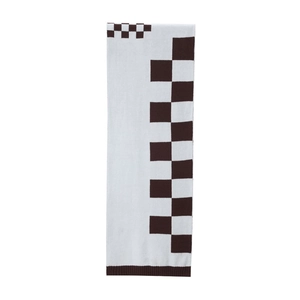 Detail of knit scarf with checkerboard pattern and ribbed edges for fall winter