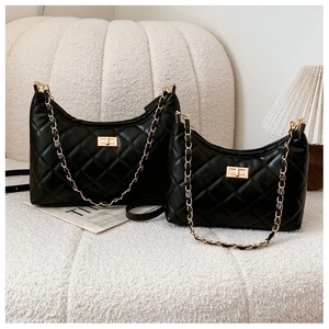 Comparison of small and large black quilted crescent bags with gold chain straps