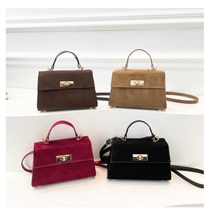 Group shot of minimalist vintage crossbody bags in suede-like finish with metal buckles