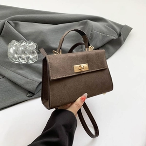 Elegant brown matte crossbody handbag with gold lock and adjustable strap for women