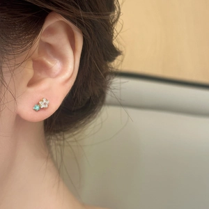 Elegant gold earrings with sparkling zircon and light blue stars for a chic style