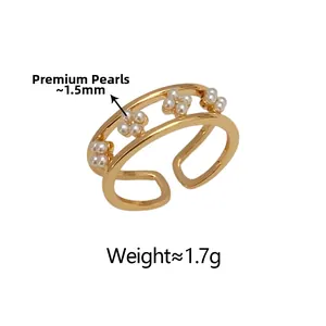 Detailed view of gold flower ring with 1.5mm lustrous pearls and minimalist open design
