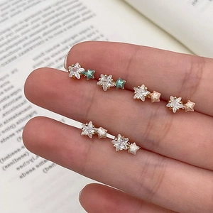 Three pairs of sweet star earrings set with crystals and macaron colored enamel