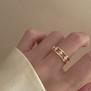 Elegant gold double-layer open ring featuring delicate pearl flowers and minimalist design