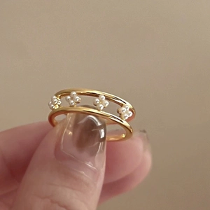 Golden double-layer open ring featuring delicate pearl flowers in an elegant design
