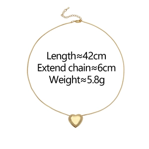 Detail of gold heart pendant with dimensions showing 42cm chain and 6cm extender