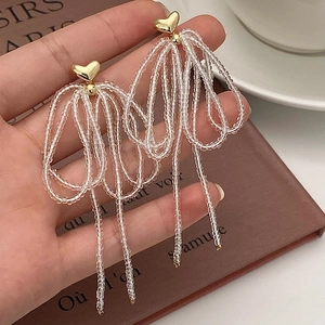 Handmade beaded bow tassel earrings with golden heart studs and soft pink beads