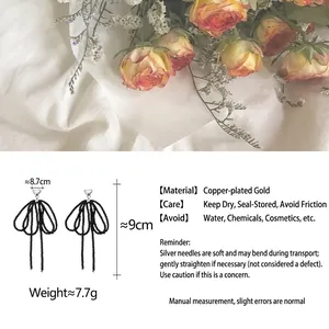 Handmade beaded bow earrings with heart studs in high-quality gold-plated copper