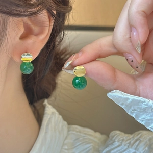 Vintage green chalcedony stud earrings with gold base and elegant marble texture