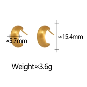 Detail view of gold C-shaped earrings showing dimensions and brushed metal texture