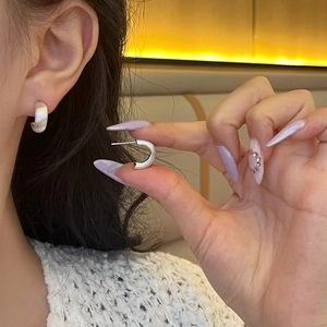 Elegant vintage silver C-shaped chunky hoop earrings with a polished geometric finish