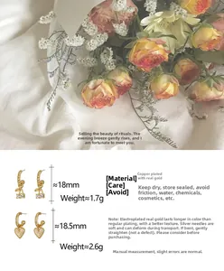 Détails des puces d'oreilles cerise en cristal et cœur brossé avec mesures