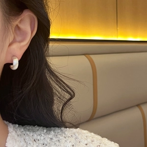 Elegant C-shaped matte silver stud earrings for women with brushed metal finish