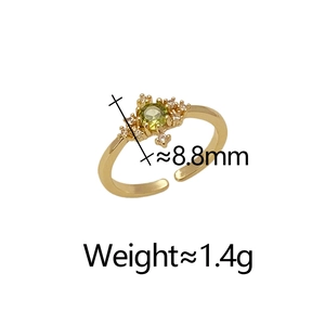 Detail view of gold-plated ring with emerald-green zirconia cluster and size specifications