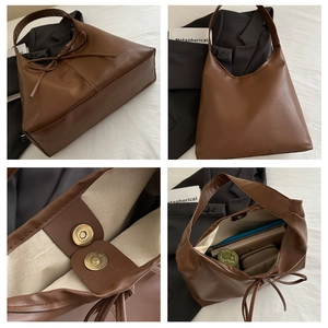 Detail view of large brown PU leather tote bag with bow tie and magnetic snap closure