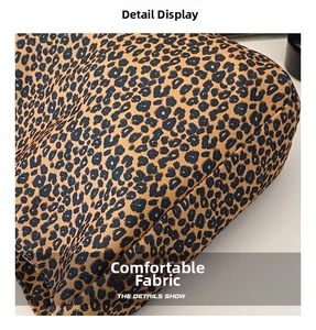 Detailed close-up showing the leopard print canvas fabric texture and precise stitching