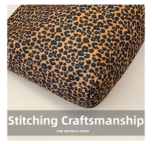 Close-up of leopard print canvas bag showing precision stitching and fabric texture