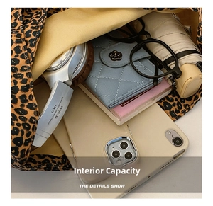 Detailed interior of leopard print tote bag showing spacious capacity for daily items