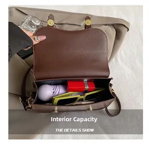 Interior view of the vintage brown saddle bag showing capacity for daily essentials