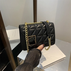 Elegant black quilted crossbody bag with gold chain strap and geometric metal buckle