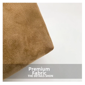 Macro detail of high-quality brown suede fabric with fine stitching for tote bag