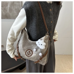 Grey shoulder bag with contrast brown straps and a white cloud plush charm detail