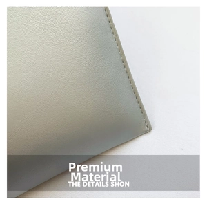 Macro view of gray leather texture with diagonal quilted stitching on envelope bag