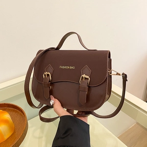 Classic dark brown PU leather saddle bag with top handle and adjustable shoulder strap