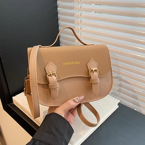 Caramel vintage saddle bag with top handle and adjustable strap in matte leather finish