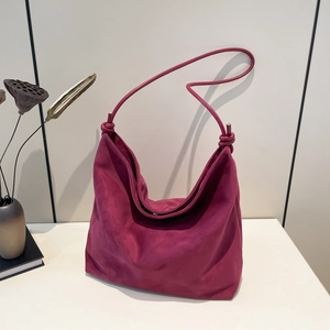 Large burgundy frosted suede tote bag with knotted shoulder strap and minimalist design