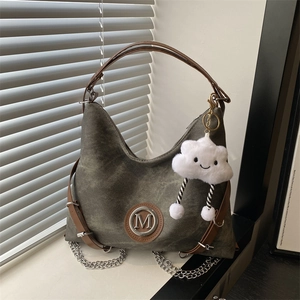 Grey canvas tote bag with brown leather straps and cute cloud plush charm