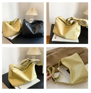 Detail view of large soft leather tote bag with smooth texture and adjustable strap