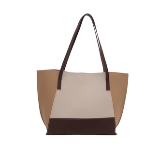 Three-tone geometric leather tote bag with long handles and spacious minimalist design