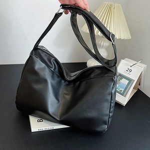 Fashionable black soft leather tote bag with large capacity and adjustable shoulder strap