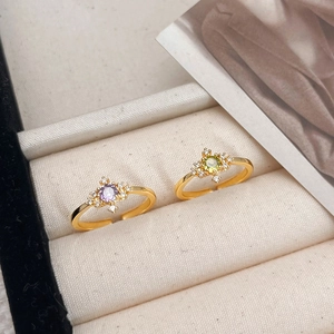 Elegant adjustable gold-plated ring set with green and purple zircon and small crystals