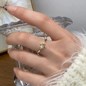 Elegant gold plated open ring featuring a round emerald zircon and sparkling crystals