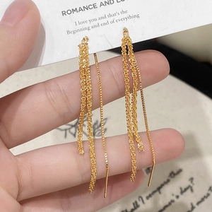 Sparkling long gold tassel earrings with multilayered delicate chain drop design