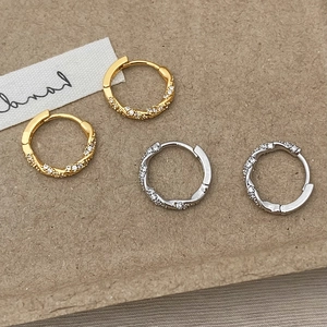Polished twist rope hoop earrings with zircon stones in gold and silver plating
