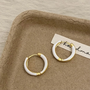 French vintage avocado green and gold hoop earrings with white enamel coating detail