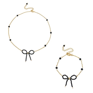 Set vintage di collana e bracciale con perline nere e ciondoli a fiocco delicati